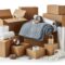 Variety of packing materials including tape, blankets, and boxes for moving